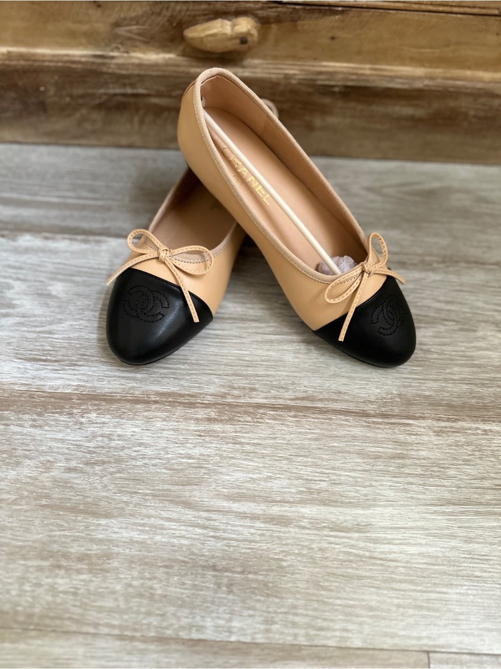 Beige and Black Cap-Toe Ballet Flats with Bow